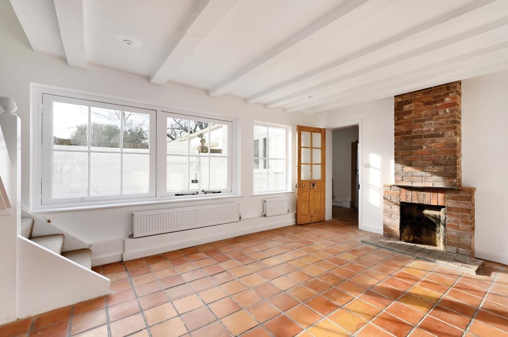 Lot: 152 - TERRACE HOUSE IN DESIRABLE LOCATION - View of living room with brick chimney place